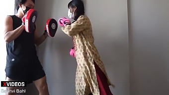 Young Indian Student Practices Boxing With A Professional